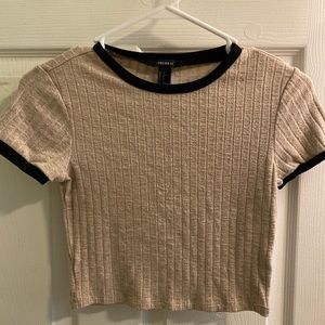 Beige and black crop top.
